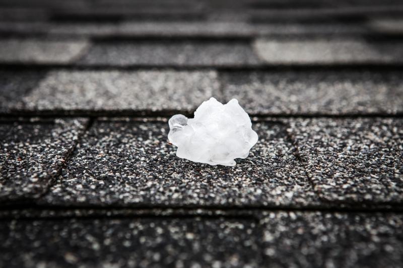 How Hail Impacts Flat Roofs, HVAC Units, and Commercial Structures